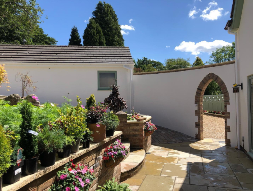 Lime render to conventional new build house UK Hempcrete