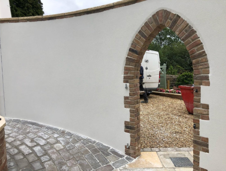 Lime render to conventional new build house UK Hempcrete